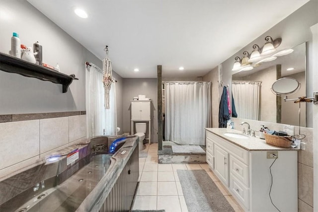 bathroom with tile patterned floors, vanity, and toilet