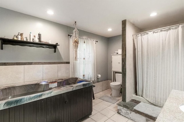 bathroom featuring tile patterned floors, vanity, and toilet