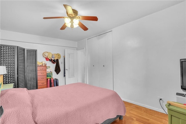 bedroom featuring ceiling fan and hardwood / wood-style floors