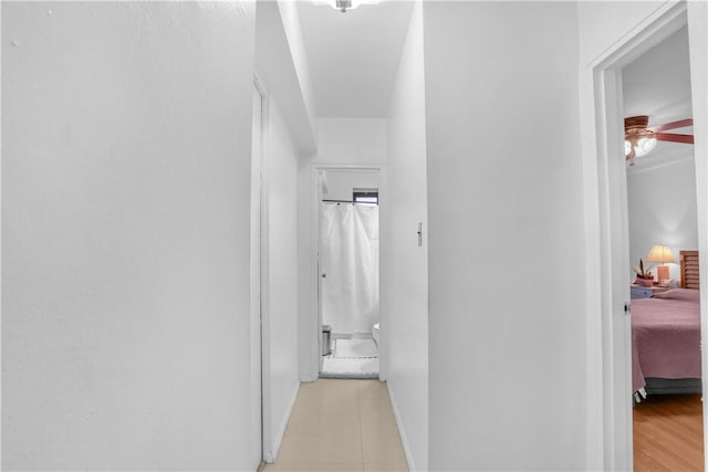 hallway with light wood-type flooring