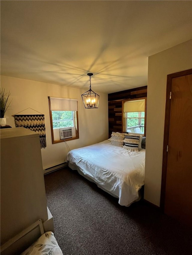 carpeted bedroom featuring wooden walls, baseboard heating, multiple windows, and cooling unit