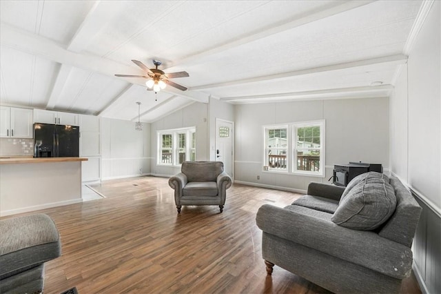 living room featuring hardwood / wood-style flooring, plenty of natural light, lofted ceiling with beams, and ceiling fan