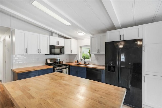 kitchen with black appliances, sink, white cabinets, and wooden counters