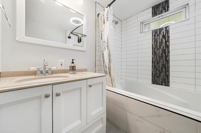 bathroom with shower / tub combo and vanity