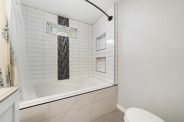 bathroom with toilet and shower / bath combo with shower curtain