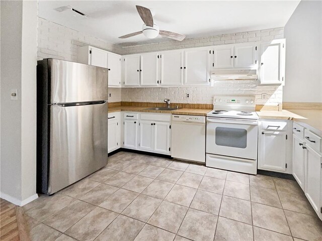 kitchen with white cabinetry, sink, ceiling fan, white appliances, and light tile patterned flooring
