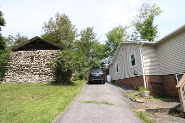 view of home's exterior featuring a yard