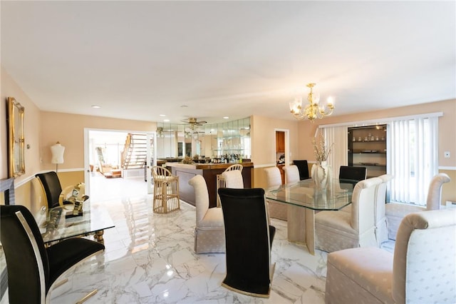 dining space with recessed lighting, marble finish floor, and a notable chandelier