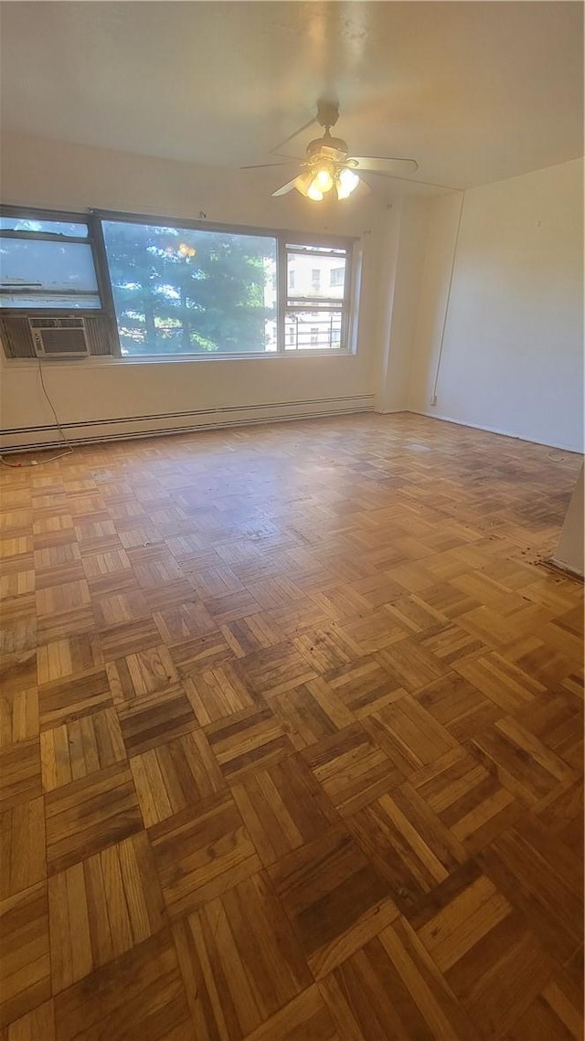 empty room featuring ceiling fan and parquet floors