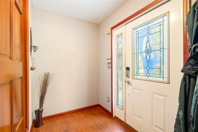 foyer entrance with light wood-type flooring