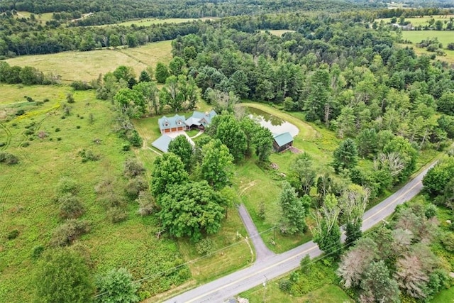 drone / aerial view featuring a view of trees