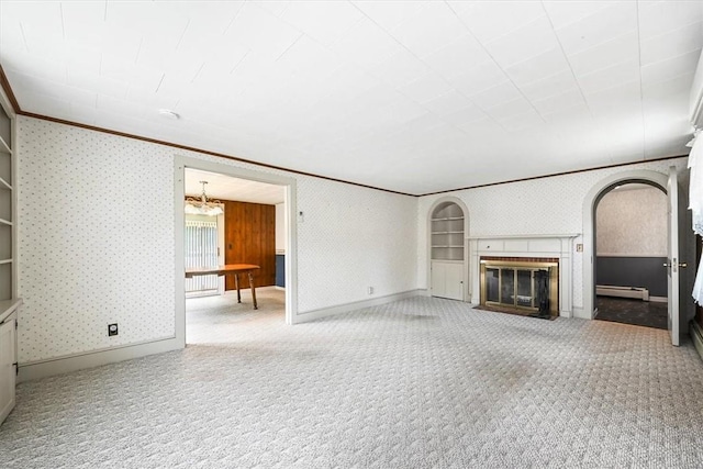 unfurnished living room featuring a fireplace, light colored carpet, baseboard heating, and ornamental molding