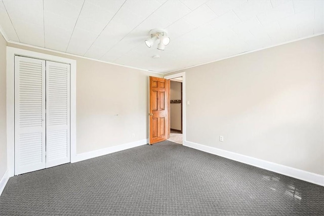 unfurnished bedroom with carpet floors and a closet