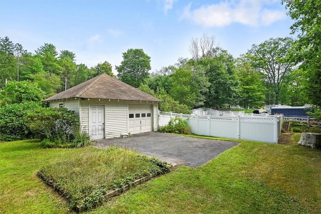 garage with a yard