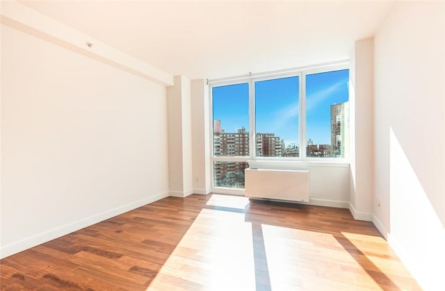 spare room with light hardwood / wood-style floors