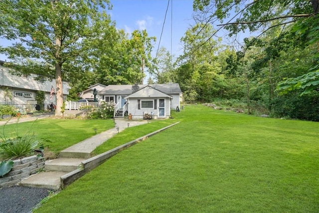 bungalow-style house with a front lawn