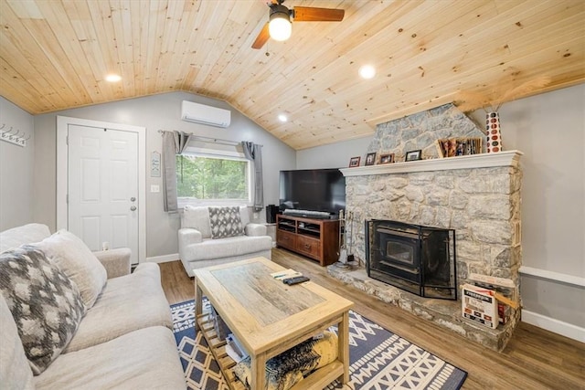 living room featuring a wall unit AC, a wood stove, wood ceiling, and wood-type flooring