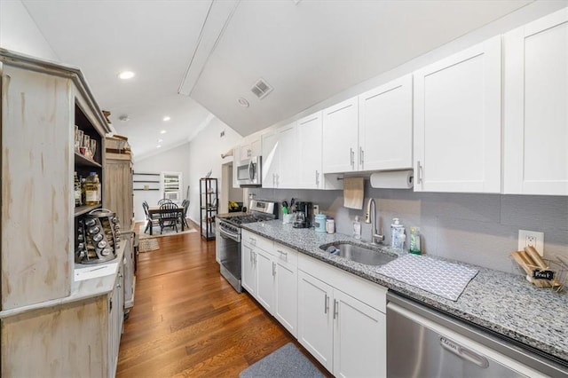 kitchen featuring sink, white cabinets, dark hardwood / wood-style floors, and appliances with stainless steel finishes