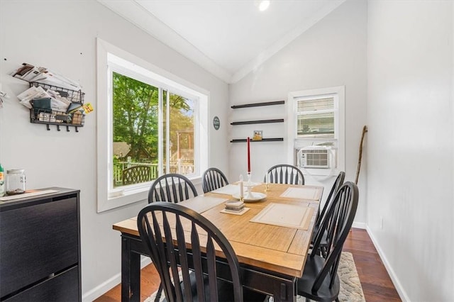 dining area featuring crown molding, dark hardwood / wood-style flooring, cooling unit, and vaulted ceiling