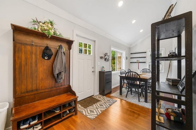 mudroom featuring hardwood / wood-style flooring and lofted ceiling