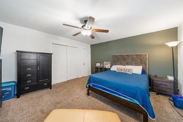 carpeted bedroom with ceiling fan and a closet