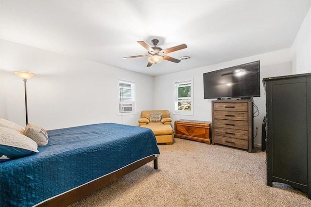 bedroom featuring ceiling fan and light colored carpet