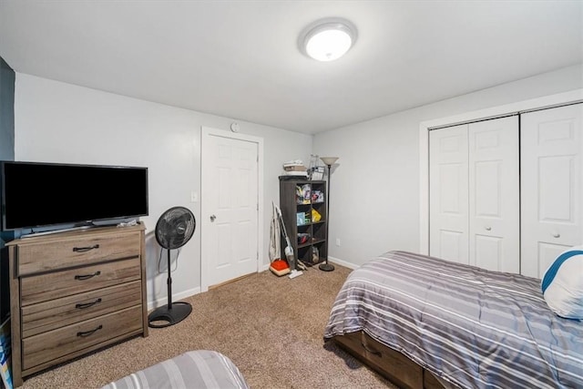 carpeted bedroom featuring a closet