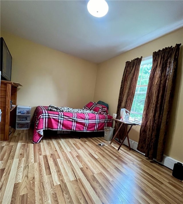 bedroom with light hardwood / wood-style floors