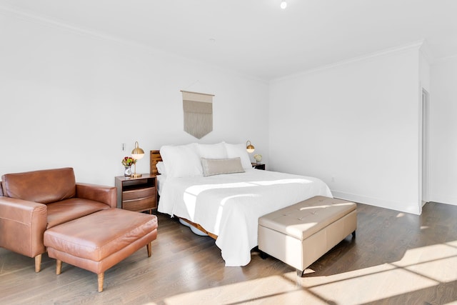 bedroom with hardwood / wood-style floors and ornamental molding