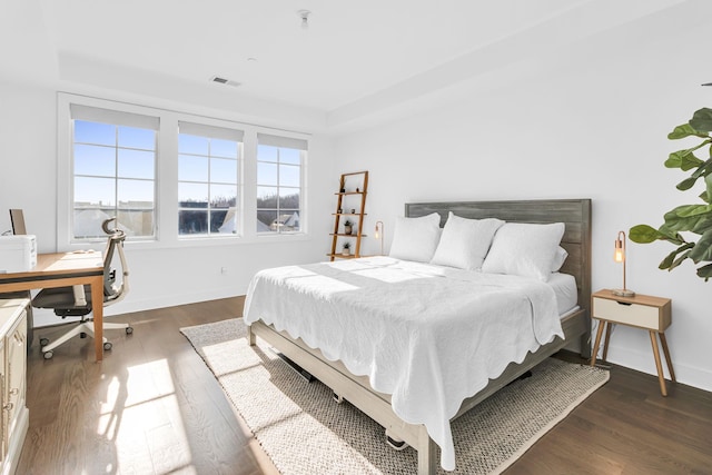 bedroom featuring dark hardwood / wood-style flooring