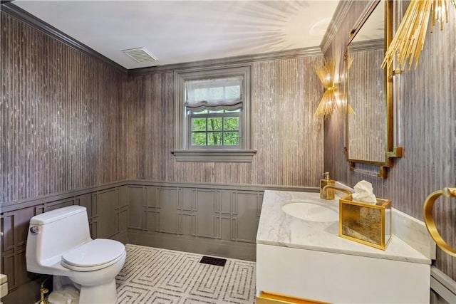 bathroom with toilet and vanity