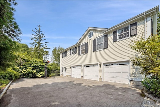 view of side of home with a garage