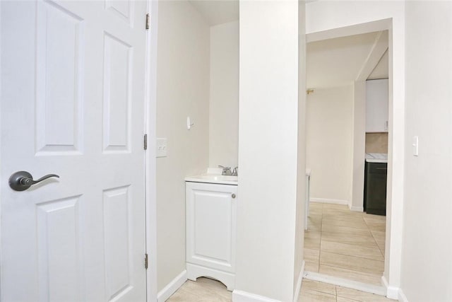 bathroom with tile patterned flooring and vanity