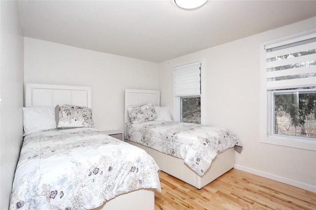 bedroom with light hardwood / wood-style flooring