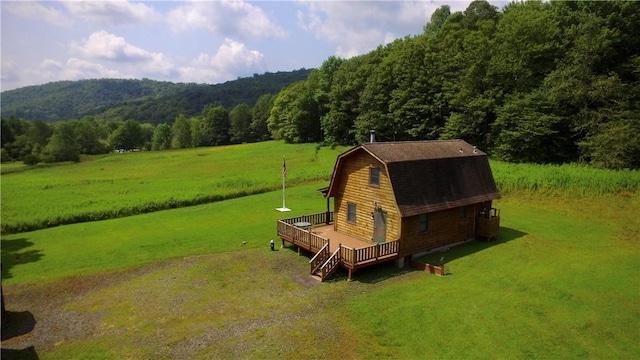 birds eye view of property with a rural view