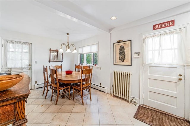 dining area featuring an inviting chandelier, light tile patterned floors, radiator, and a baseboard radiator