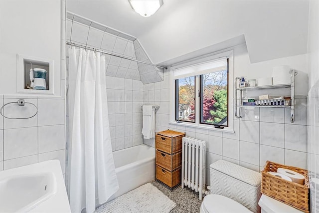 bathroom featuring lofted ceiling, radiator, toilet, tile walls, and shower / tub combo with curtain