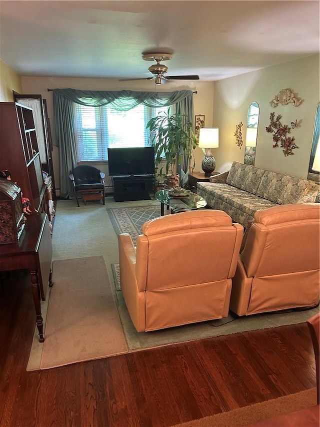 living room with hardwood / wood-style floors and ceiling fan