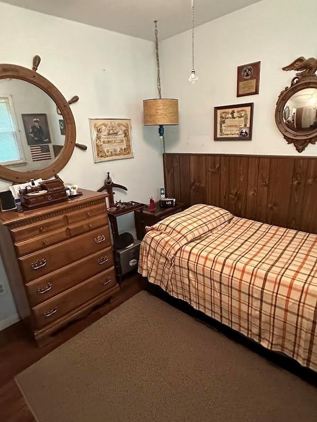 bedroom with wooden walls