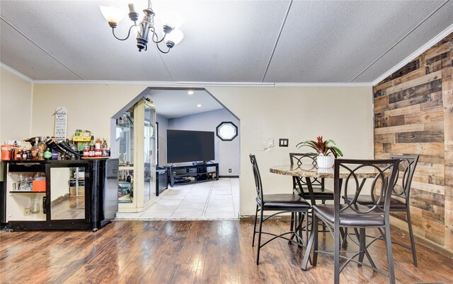 2424 State Route 17k, Montgomery, NY 12549 - dining area featuring ornamental molding, wood finished floors, a chandelier, a textured ceiling, and lofted ceiling