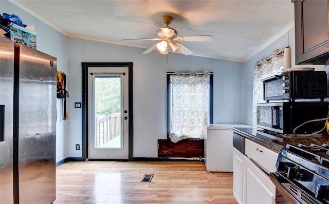 2424 State Route 17k, Montgomery, NY 12549 - kitchen featuring vaulted ceiling, ornamental molding, gas range, light wood-style flooring, and ceiling fan