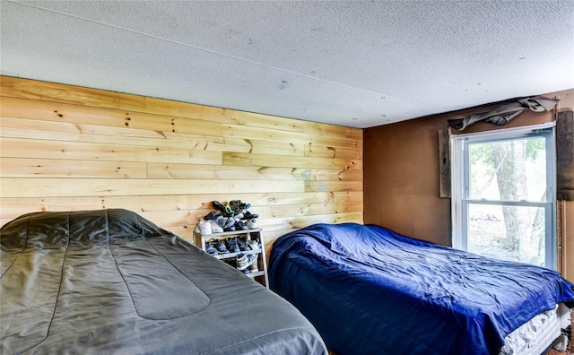 2424 State Route 17k, Montgomery, NY 12549 - bedroom with a textured ceiling and wooden walls