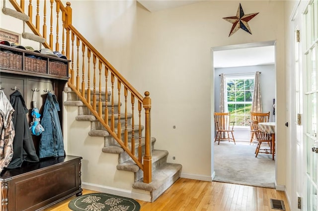 stairway featuring wood-type flooring