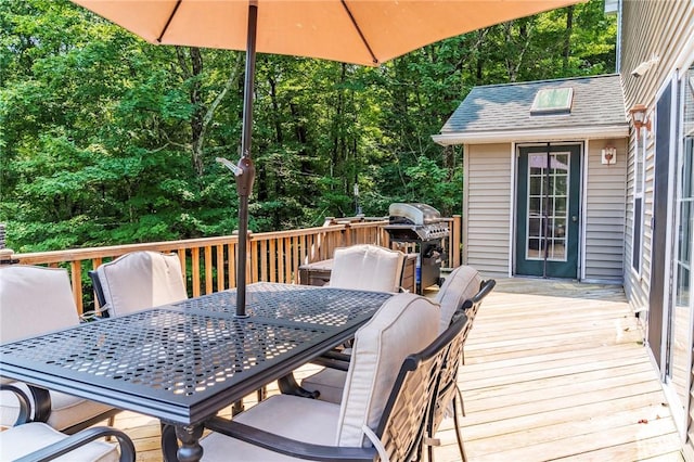 wooden deck with a grill