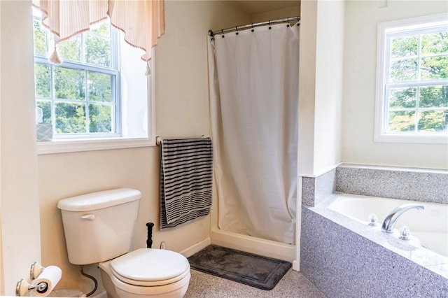 bathroom with curtained shower and toilet