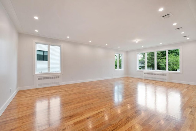 23 Northbrook Rd Unit 202, Spring Valley, NY 10977 - empty room featuring radiator, light wood-style flooring, and recessed lighting