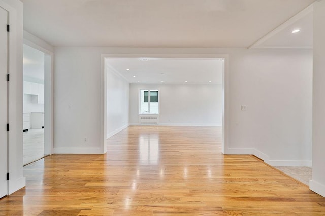 23 Northbrook Rd Unit 202, Spring Valley, NY 10977 - spare room featuring light wood finished floors, baseboards, recessed lighting, and radiator