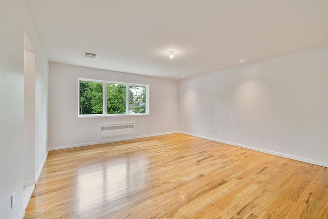 23 Northbrook Rd Unit 202, Spring Valley, NY 10977 - unfurnished room with radiator, light wood-style floors, and baseboards