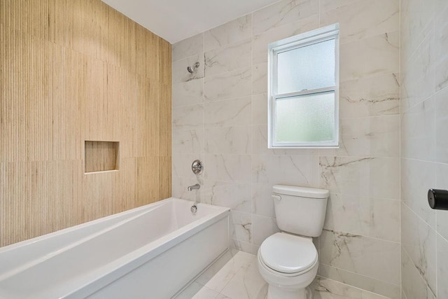 23 Northbrook Rd Unit 202, Spring Valley, NY 10977 - full bathroom with tile walls, toilet, washtub / shower combination, and marble finish flooring