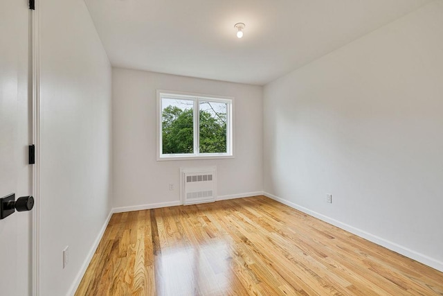 23 Northbrook Rd Unit 202, Spring Valley, NY 10977 - spare room with radiator, baseboards, and wood finished floors